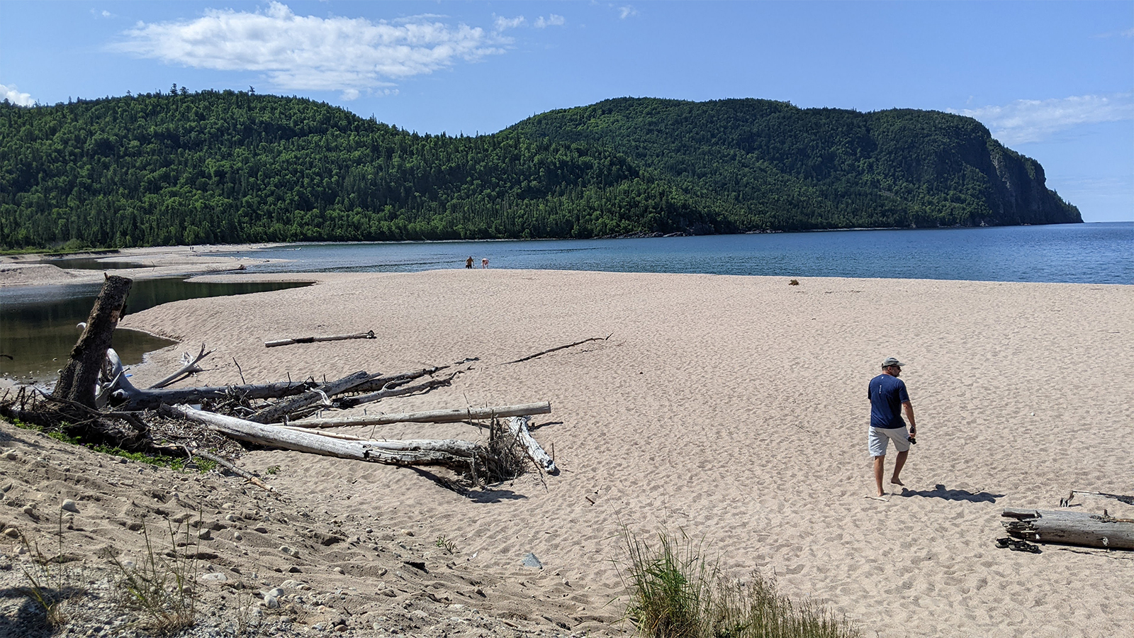 A lone traveler approaching the shoreline to meet Old Woman Bay in the distance.