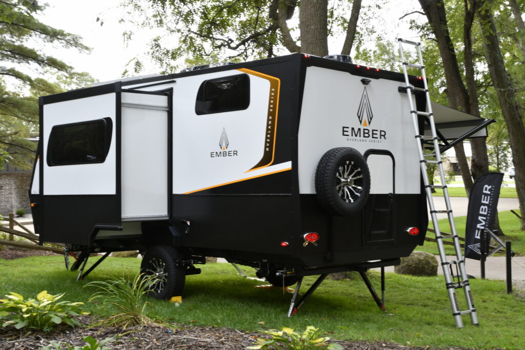 Most RVs come with ladders to let you inspect the roof and rooftop accessories. This Ember RV model has a telescoping ladder.