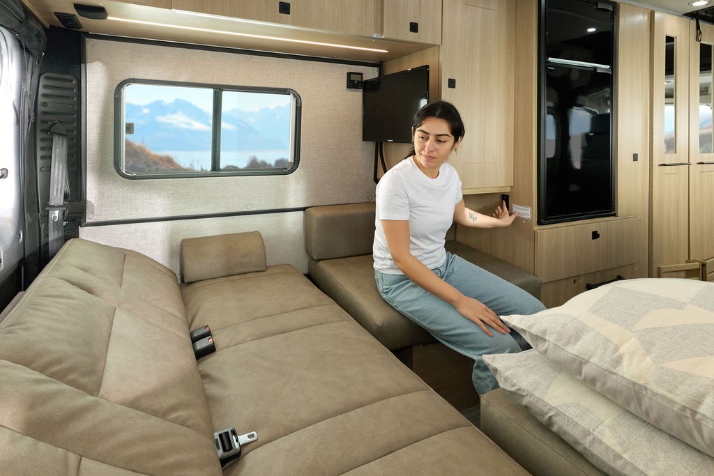 Roadtrek 2025 Play + interior, showing sofa bed.