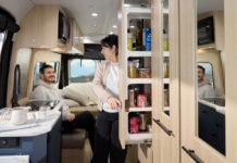 Roadtrek 2025 Play + model interior showing galley pantry and rear lounge in dinette mode.