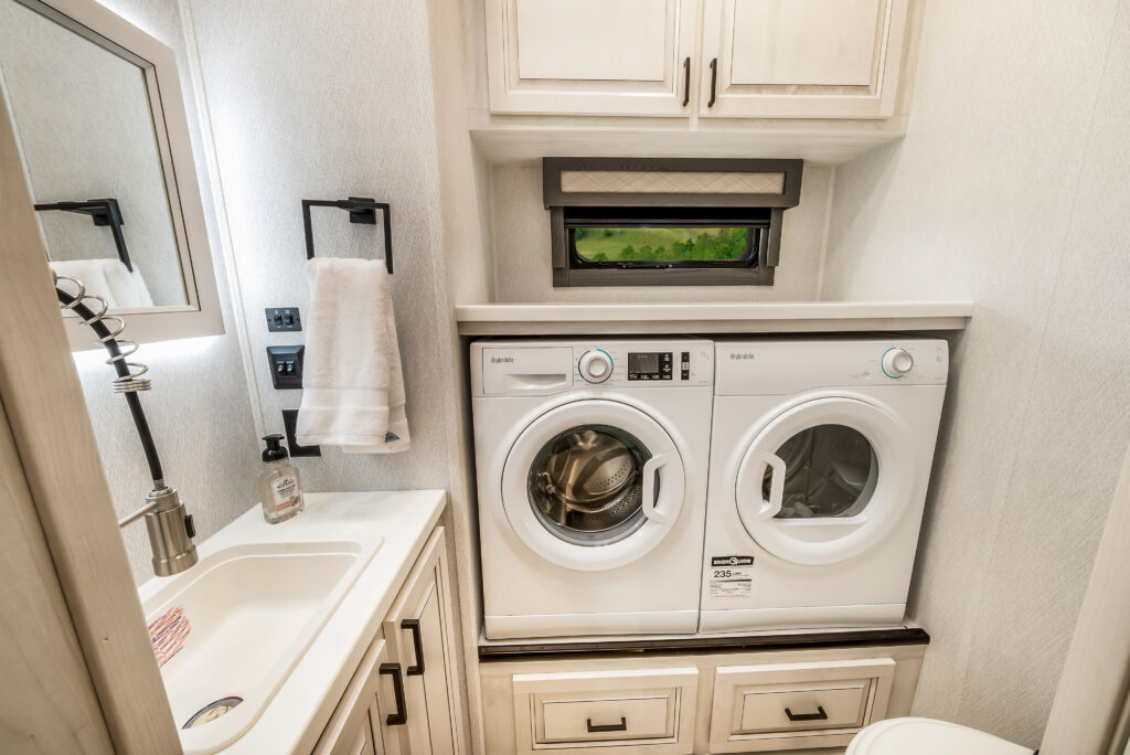 East to West RV Ahara 395 interior showing bathroom and laundry.